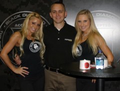 Rhett Fleitz (The Fire Critic) poses with the booth babes at Black Diamond Boots!