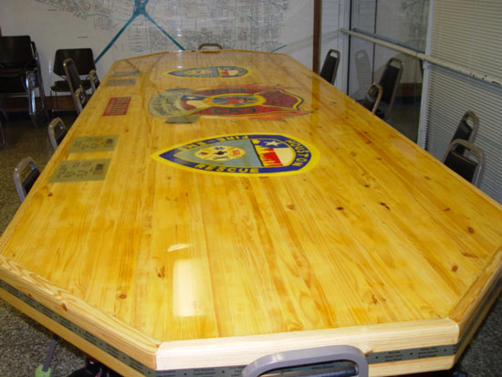 Houston Fire Department Station 68. This table is extravagant. It features fire hydrants as legs (one painted by each shift). It also features the crews at the station for each shift at the time of the build. 